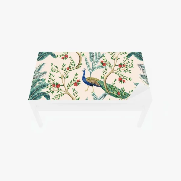 Naklejka na biurko i stół paw wśród gałęzi granatu