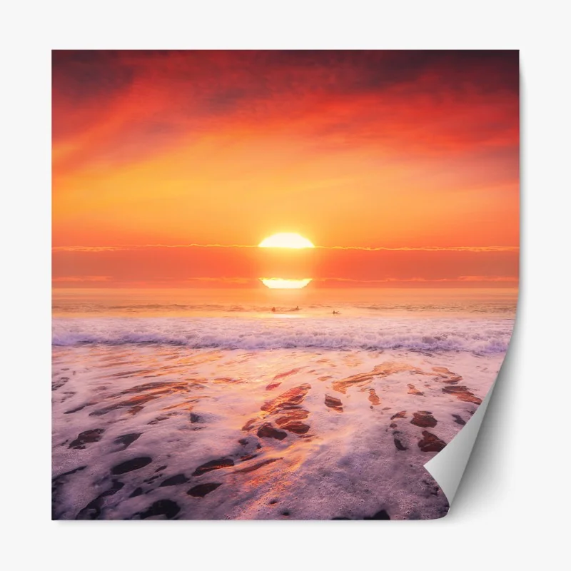 Naklejka repozycjonowalna złoty zachód słońca nad spokojną plażą