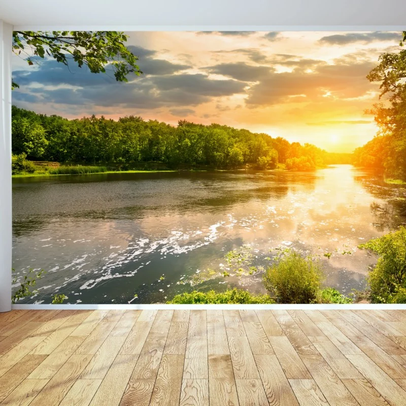 Fototapeta spokojny zachód słońca nad rzeką i zielonym lasem – Wallissimo®