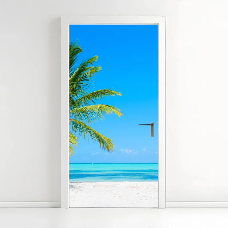 Naklejka na drzwi tropikalna palma na białej plaży