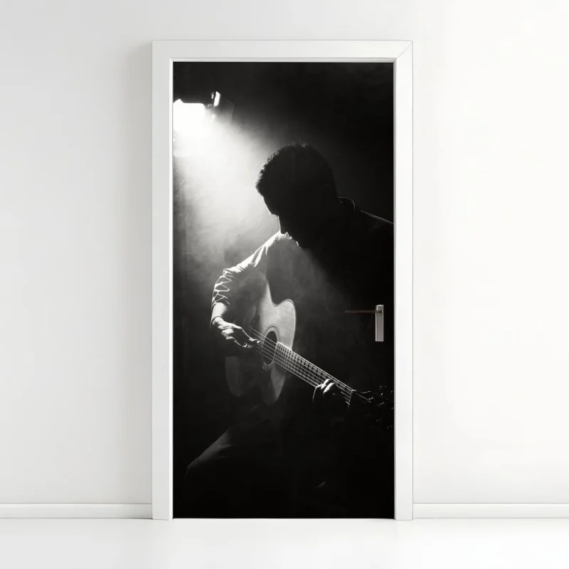 Naklejka na drzwi sylwetka gitarzysty w świetle reflektora