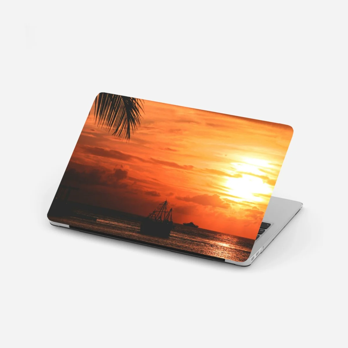 Naklejka na laptopa tropikalny zachód słońca nad morzem – Wallissimo®