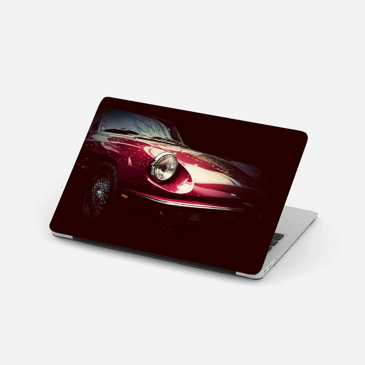 Naklejka na laptopa zbliżenie klasycznego czerwonego samochodu sportowego – Wallissimo® Naklejka na laptopa zbliżenie klasycznego czerwonego samochodu sportowego – Wallissimo®