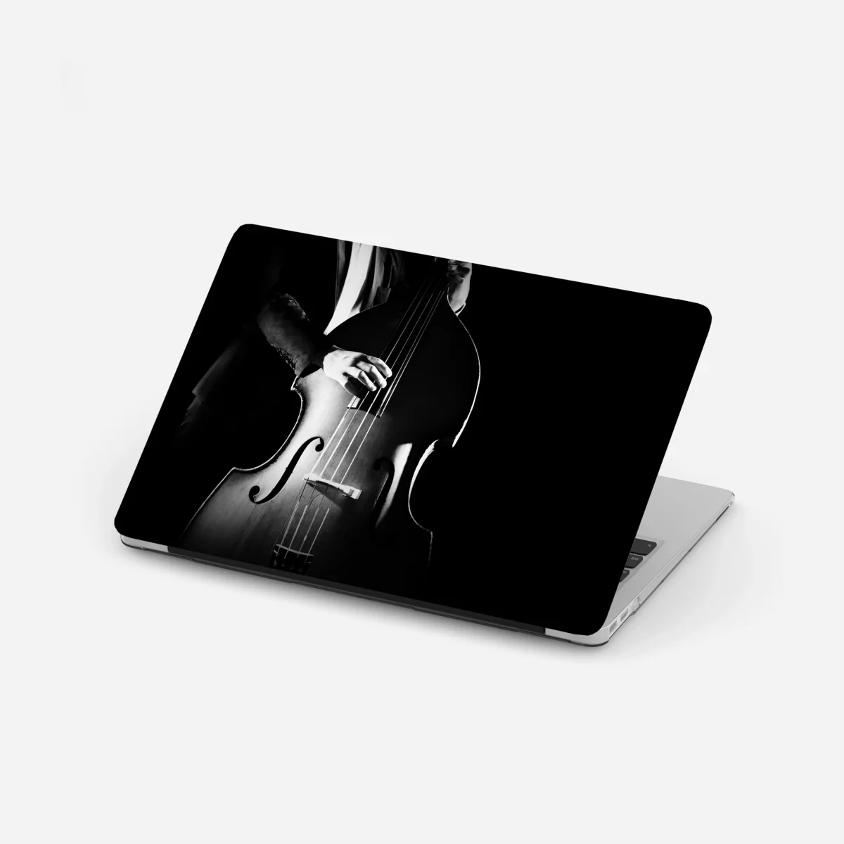 Naklejka na laptopa kontrabasista w dramatycznym świetle – Wallissimo® Naklejka na laptopa kontrabasista w dramatycznym świetle – Wallissimo®