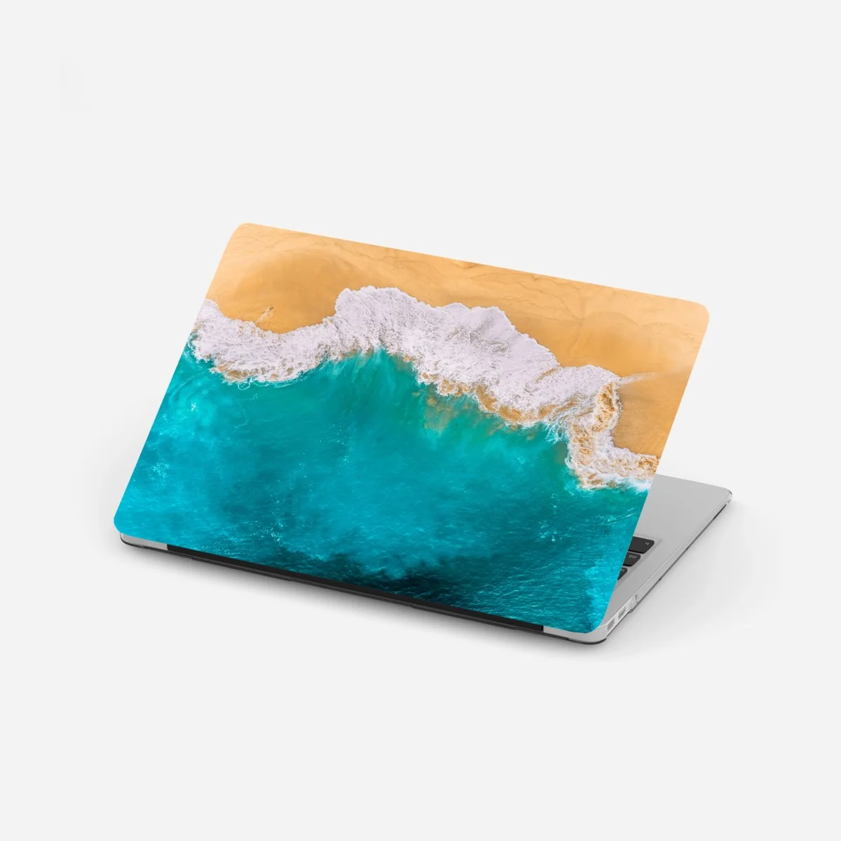 Naklejka na laptopa turkusowe fale nad plażą Kelingking, Nusa Penida – Wallissimo® Naklejka na laptopa turkusowe fale nad plażą Kelingking, Nusa Penida – Wallissimo®