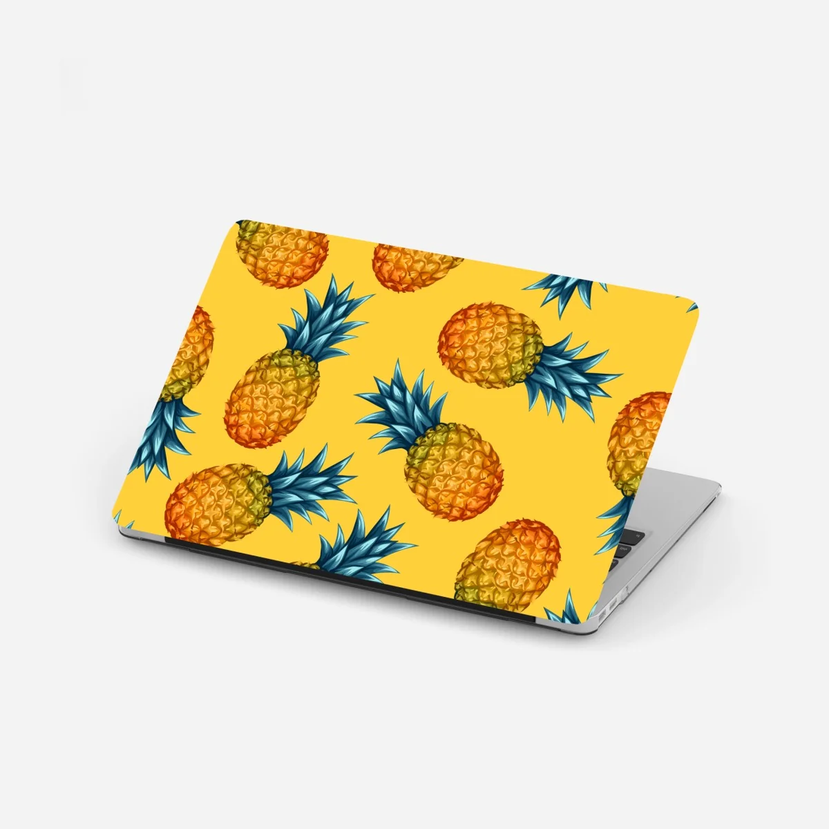 Naklejka na laptopa tropikalny wzór z ananasami na żółtym tle – Wallissimo® Naklejka na laptopa tropikalny wzór z ananasami na żółtym tle – Wallissimo®