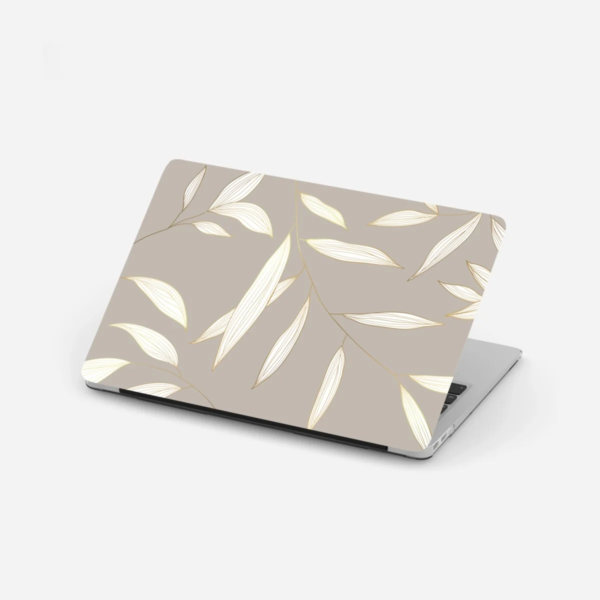 Naklejka na laptopa delikatne liście z złotym obrysem na beżowym tle – Wallissimo® Naklejka na laptopa delikatne liście z złotym obrysem na beżowym tle – Wallissimo®