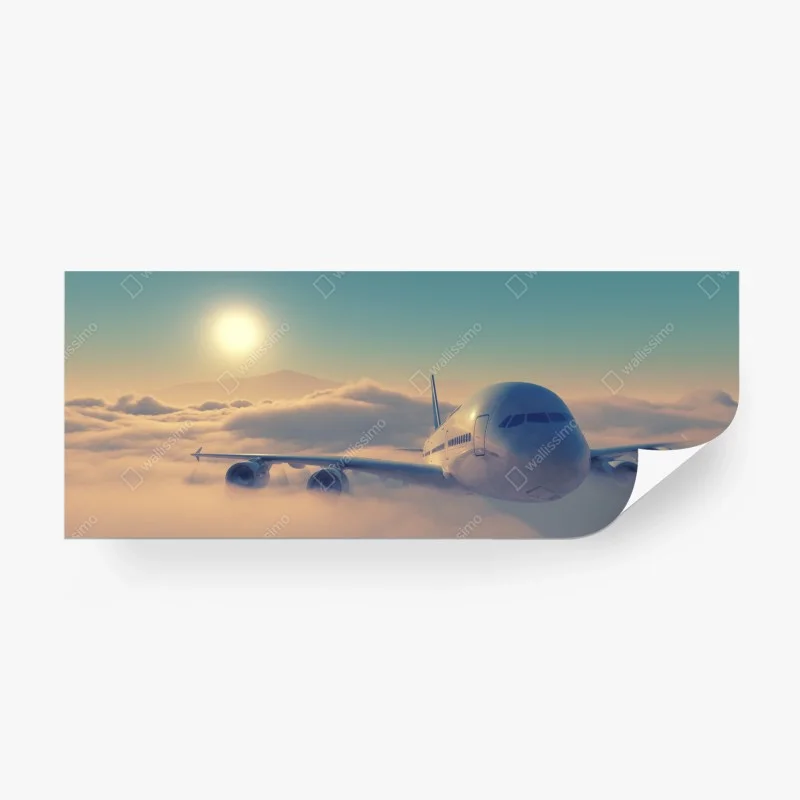 Fototapeta samolot nad chmurami o wschodzie słońca