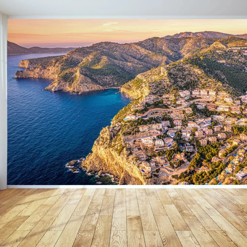 Fototapeta zachód słońca nad klifem i nadmorską wioską