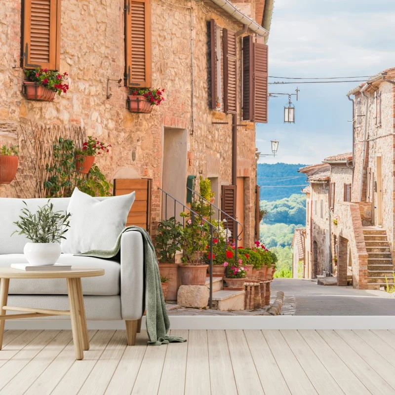 Fototapeta średniowieczna ulica w Toskanii z doniczkami z kwiatami
