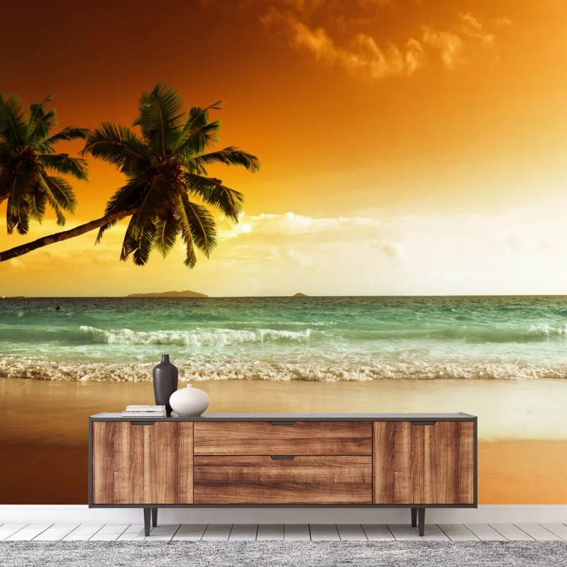 Fototapeta plaża przy zachodzie słońca na Karaibach z palmami