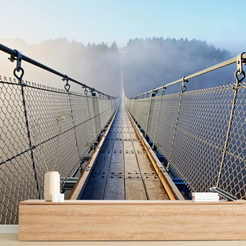 Fototapeta mglisty wiszący most prowadzący w las