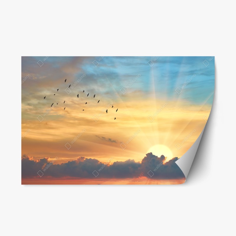 Naklejka repozycjonowalna złoty wschód słońca nad chmurami