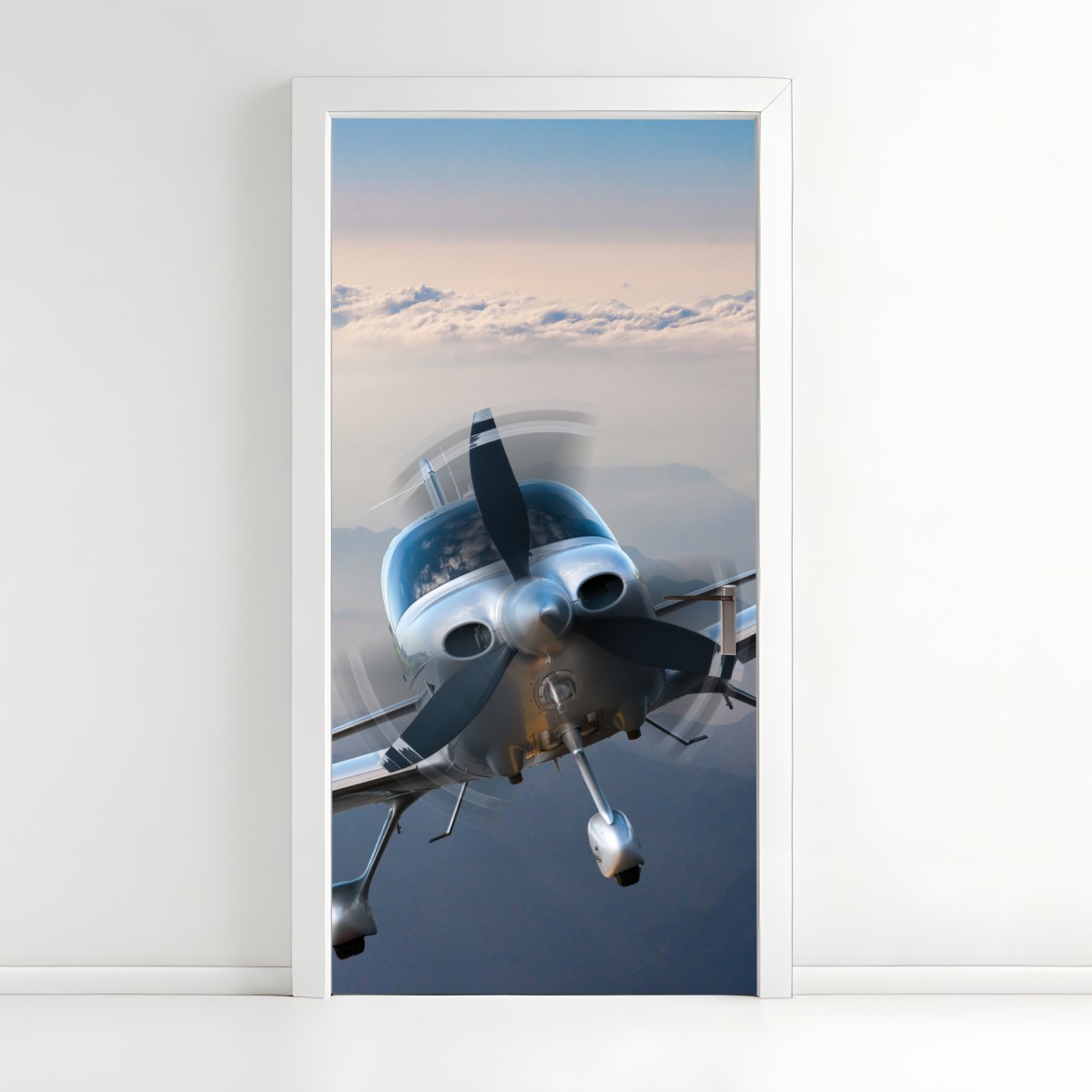 Door sticker silver propeller plane over misty mountains