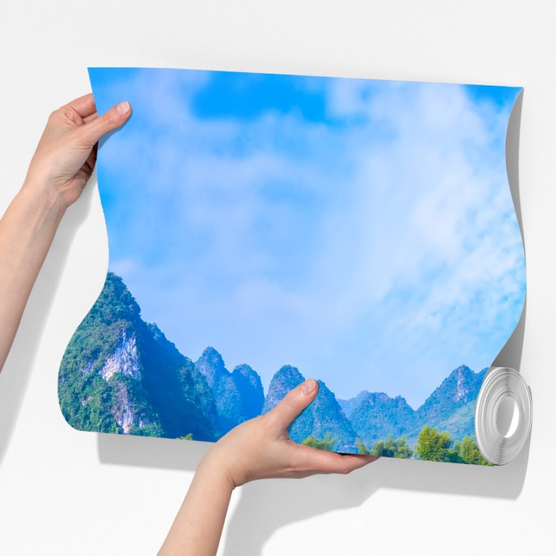 Fototapeta bujna panorama wodospadu z wapiennymi górami – Wallissimo® Fototapeta bujna panorama wodospadu z wapiennymi górami – Wallissimo®