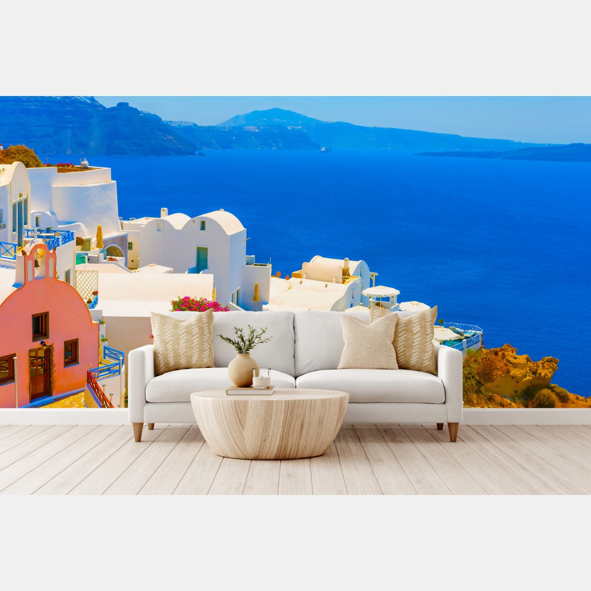 Wall mural sunlit view of Santorini's white villas and blue sea