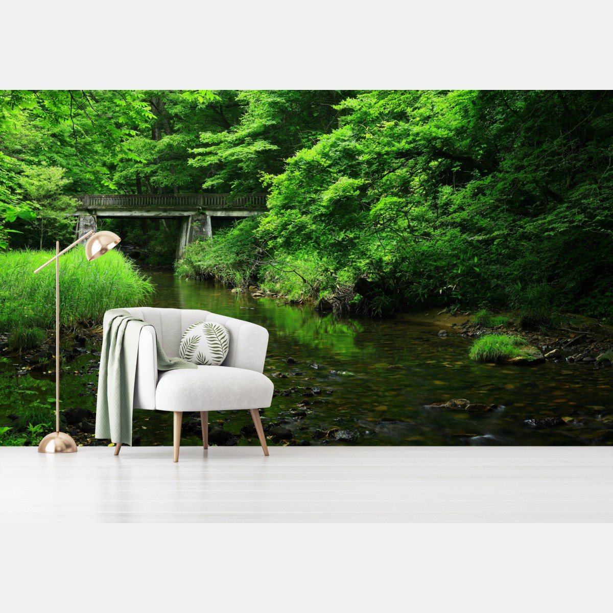 Wall mural lush green forest stream with stone bridge