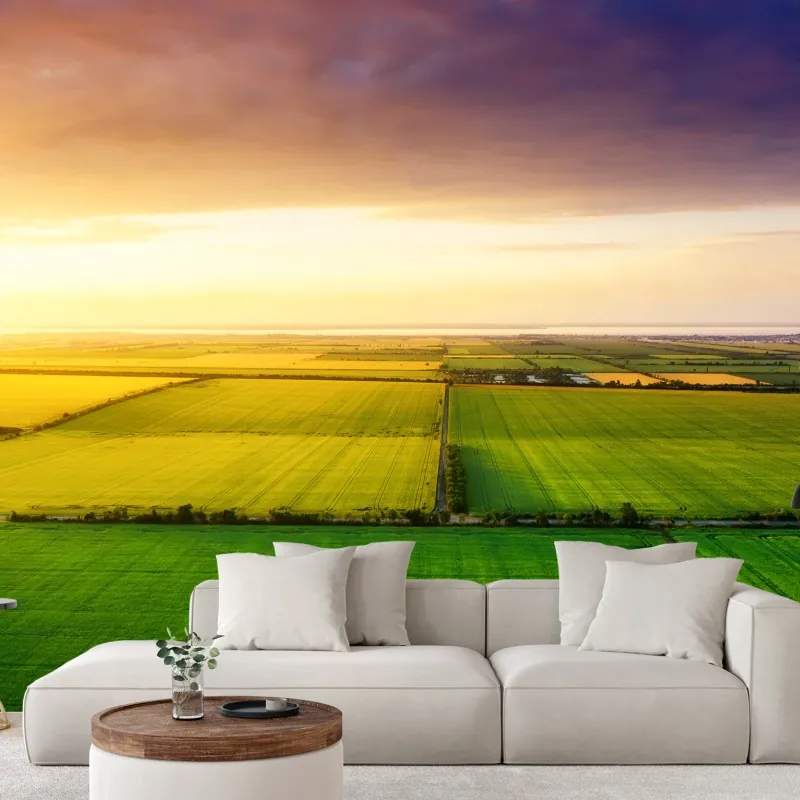 Fototapeta zachód słońca nad zielonymi polami