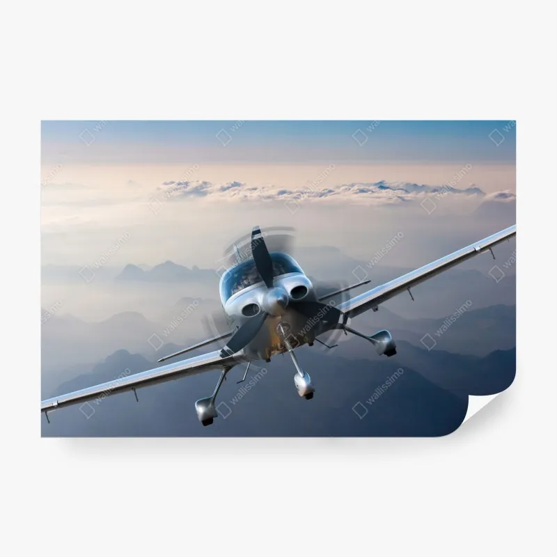 Fototapeta srebrny samolot śmigłowy nad mglistymi górami