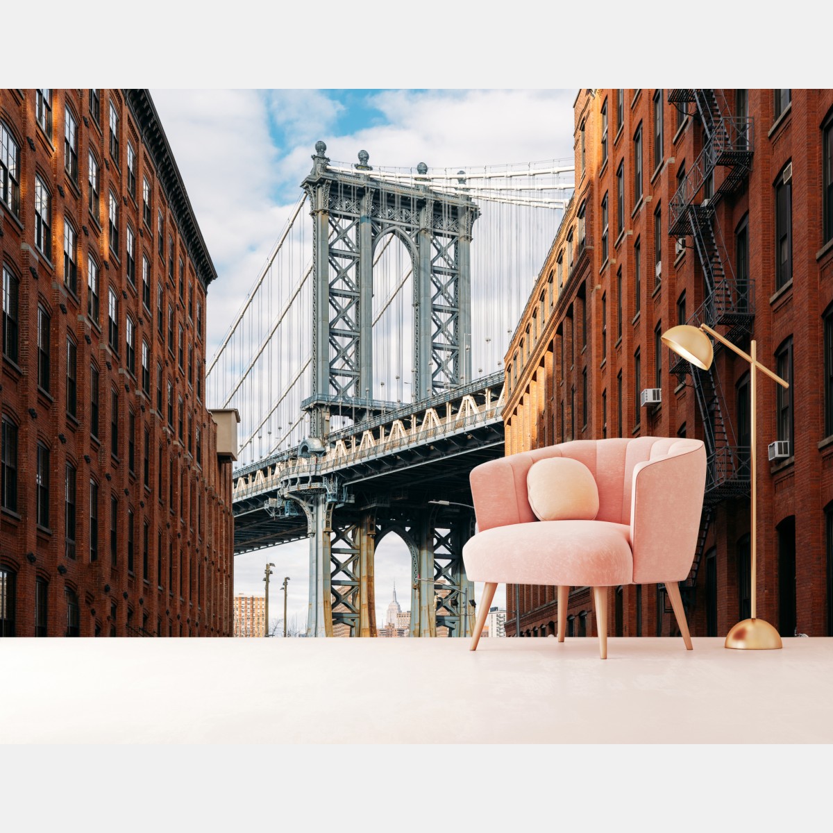Wall mural Brooklyn bridge framed by brick buildings at sunset