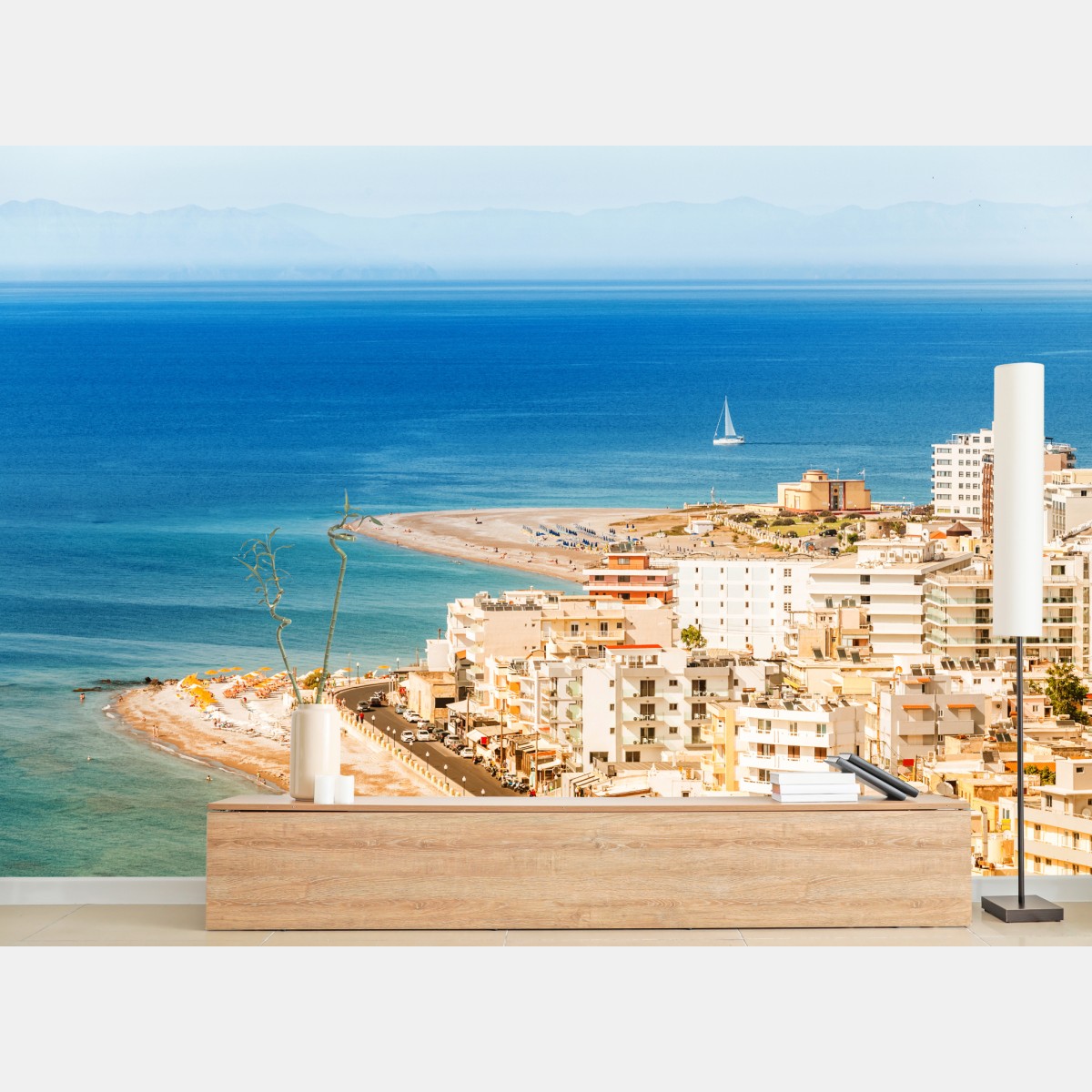 Wall mural sunny coastal cityscape with sailboat