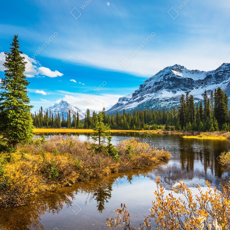 Fototapeta Góry Skaliste nad jeziorem z odbiciem – Wallissimo® Fototapeta Góry Skaliste nad jeziorem z odbiciem – Wallissimo®