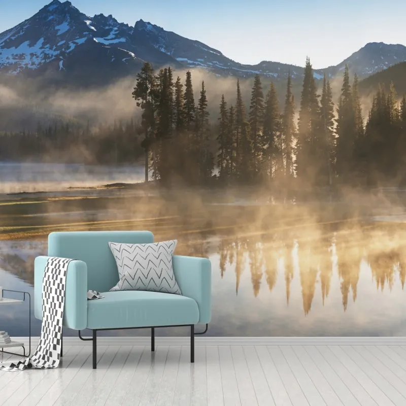 Fototapeta mglisty wschód słońca nad górami z odbiciem