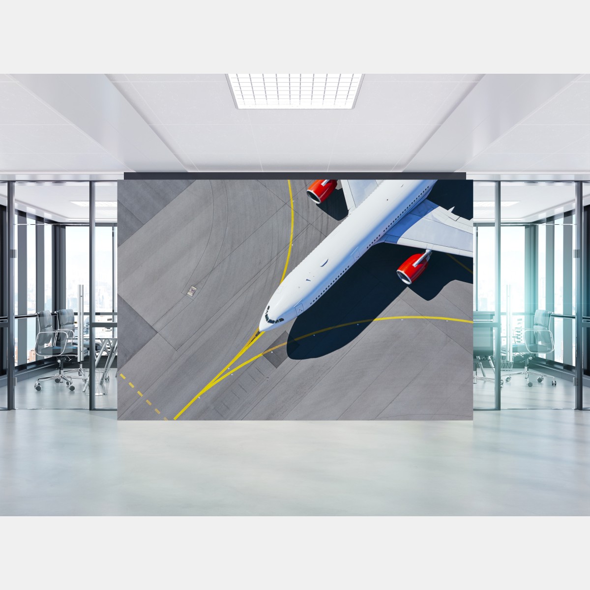Wall mural aerial view of a white airplane on tarmac