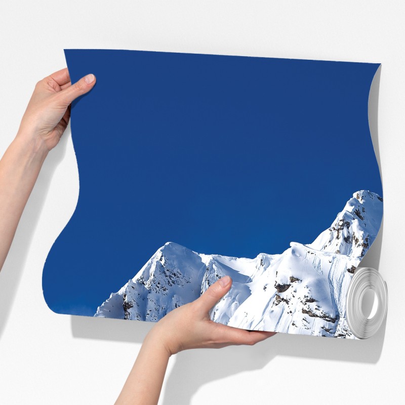 Fototapeta śnieżny alpejski szczyt pod głębokim błękitnym niebem – Wallissimo® Fototapeta śnieżny alpejski szczyt pod głębokim błękitnym niebem – Wallissimo®