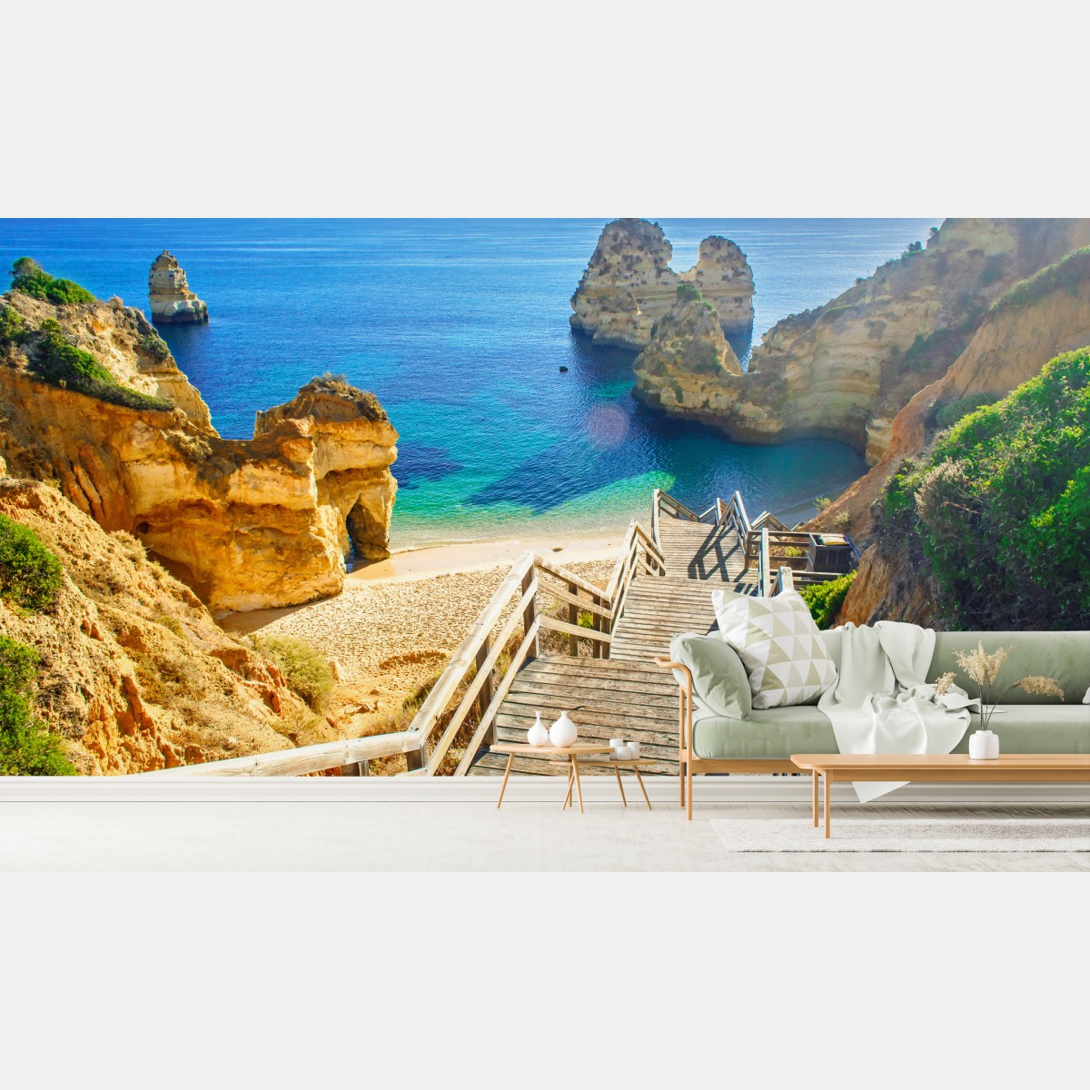 Wall mural sunlit coastal steps to a turquoise cove