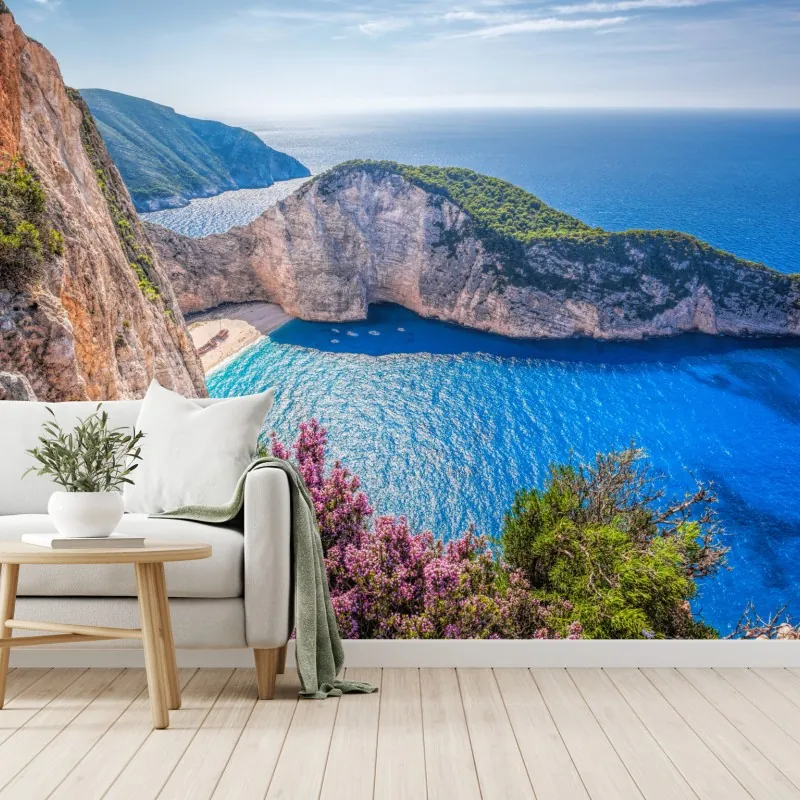 Fototapeta Navagio plaża o zachodzie słońca z turkusowym morzem i dzikimi kwiatami