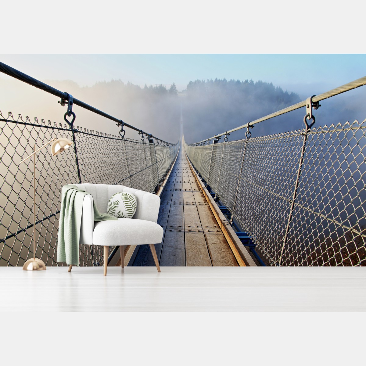 Wall mural foggy suspension bridge leading into the woods