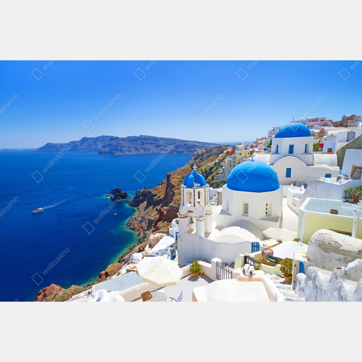 Fototapeta Santorini błękitne kopuły nad kalderą – Wallissimo® Fototapeta Santorini błękitne kopuły nad kalderą – Wallissimo®