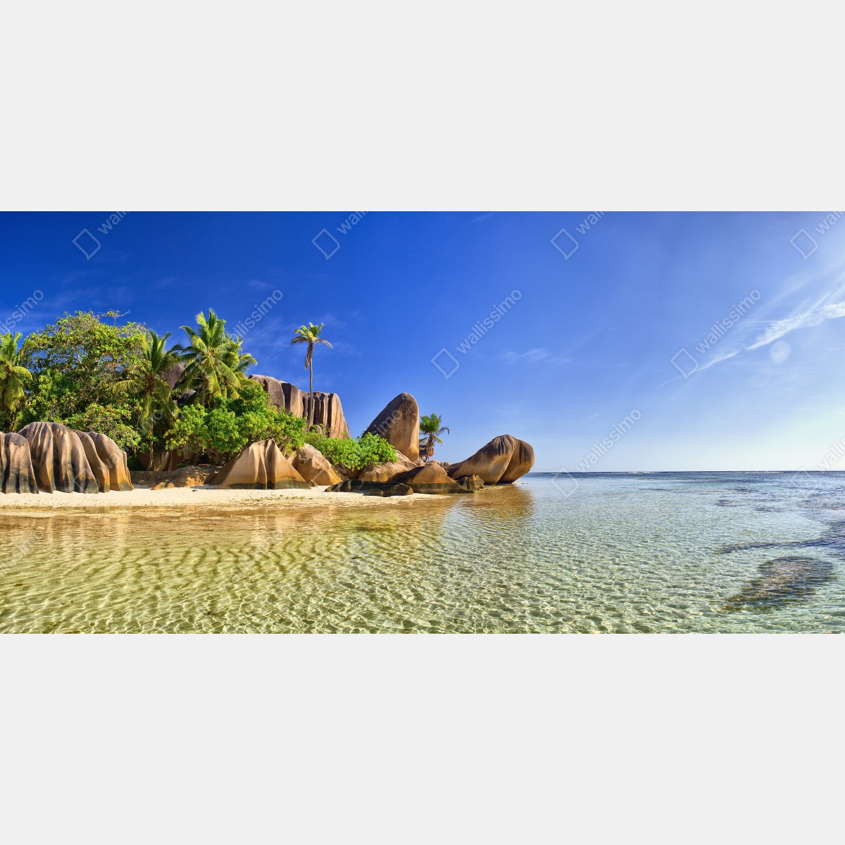 Naklejka repozycjonowalna tropikalna plaża z granitowymi głazami i klarowną wodą – Wallissimo® Naklejka repozycjonowalna tropikalna plaża z granitowymi głazami i klarowną wodą – Wallissimo®