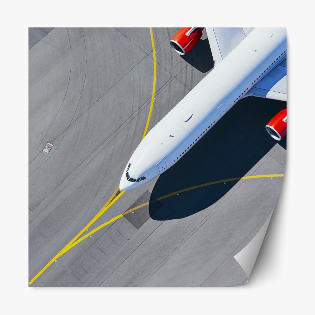 Repositionable sticker aerial view of a white airplane on tarmac