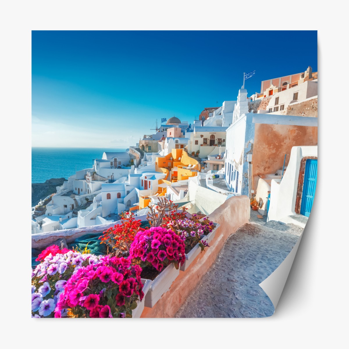 Repositionable sticker sunlit Santorini cliffside village