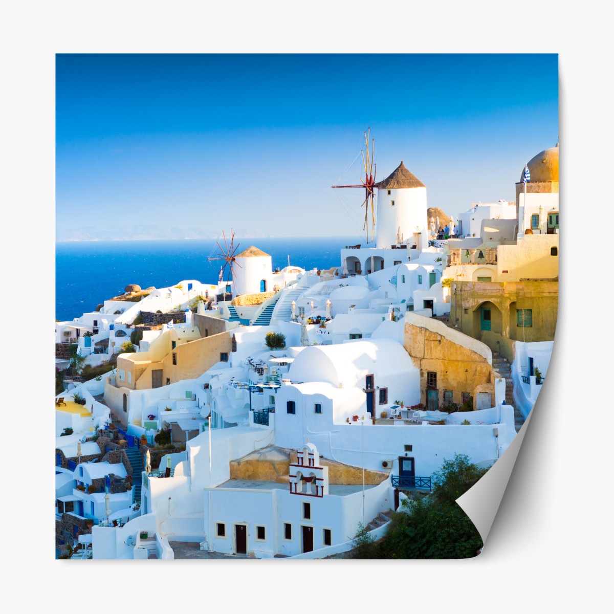 Repositionable sticker sunlit Santorini village by the sea