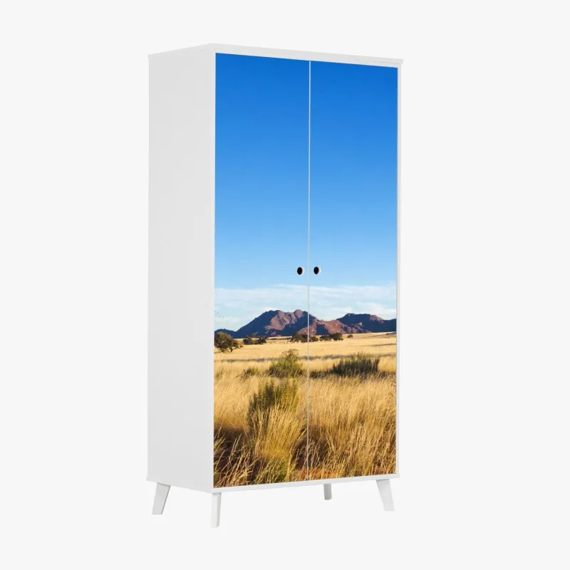 Naklejka na szafę spokojny krajobraz sawanny pod bezchmurnym niebem