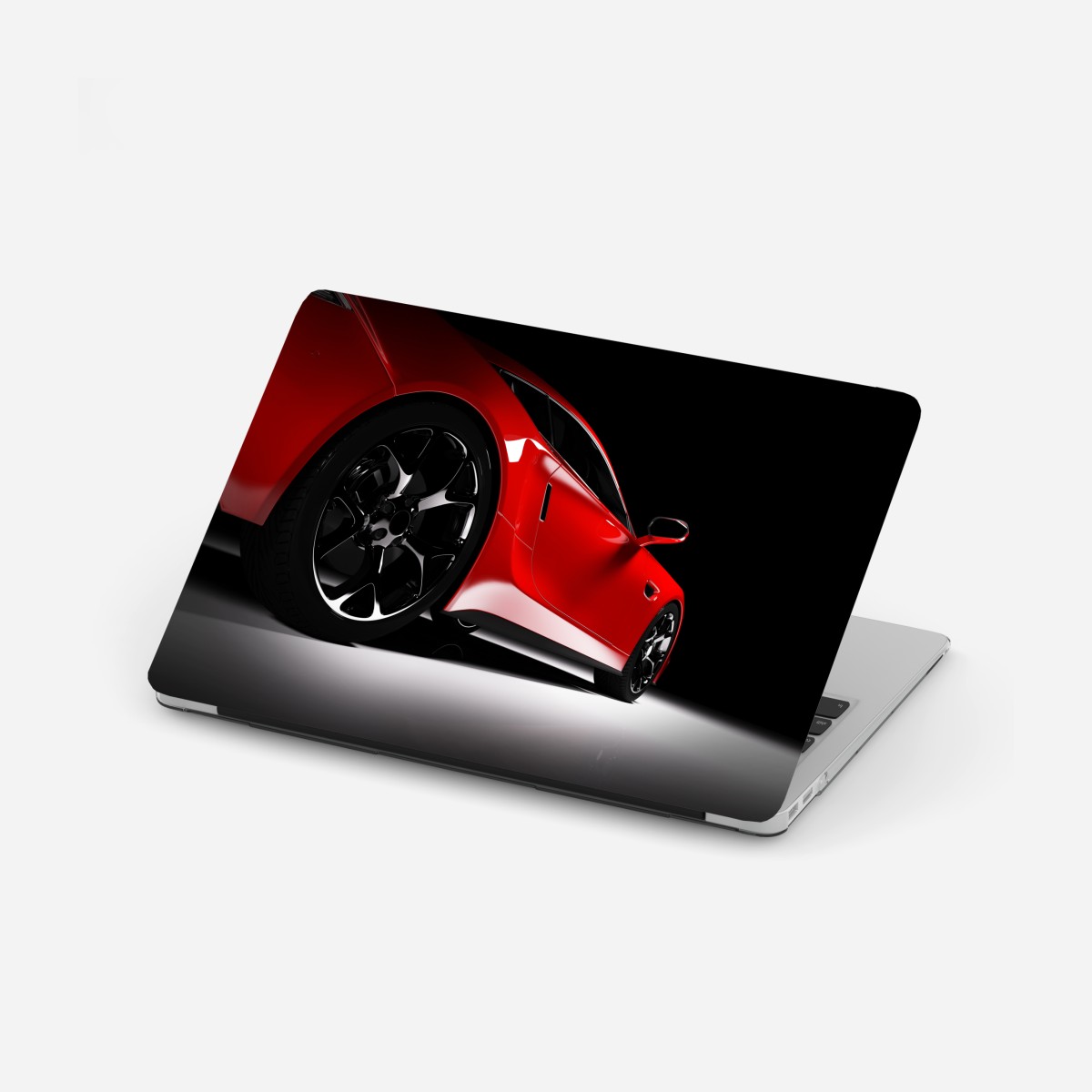 Laptop sticker red sports car close-up