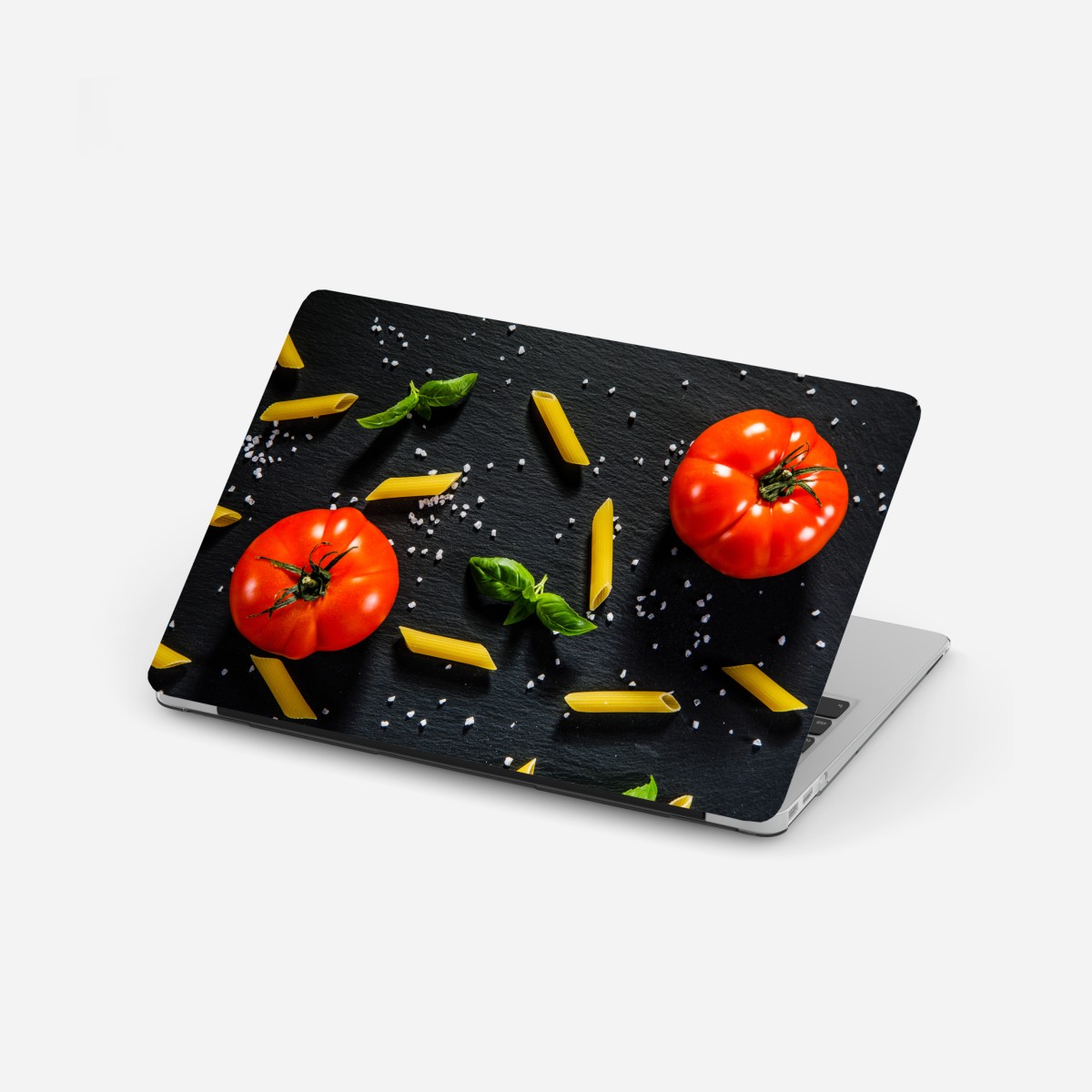 Laptop sticker tomato and pasta flat lay on black slate