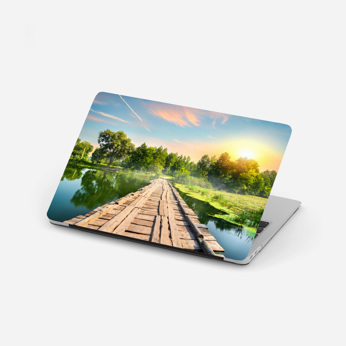 Laptop sticker sunlit wooden bridge over tranquil lake