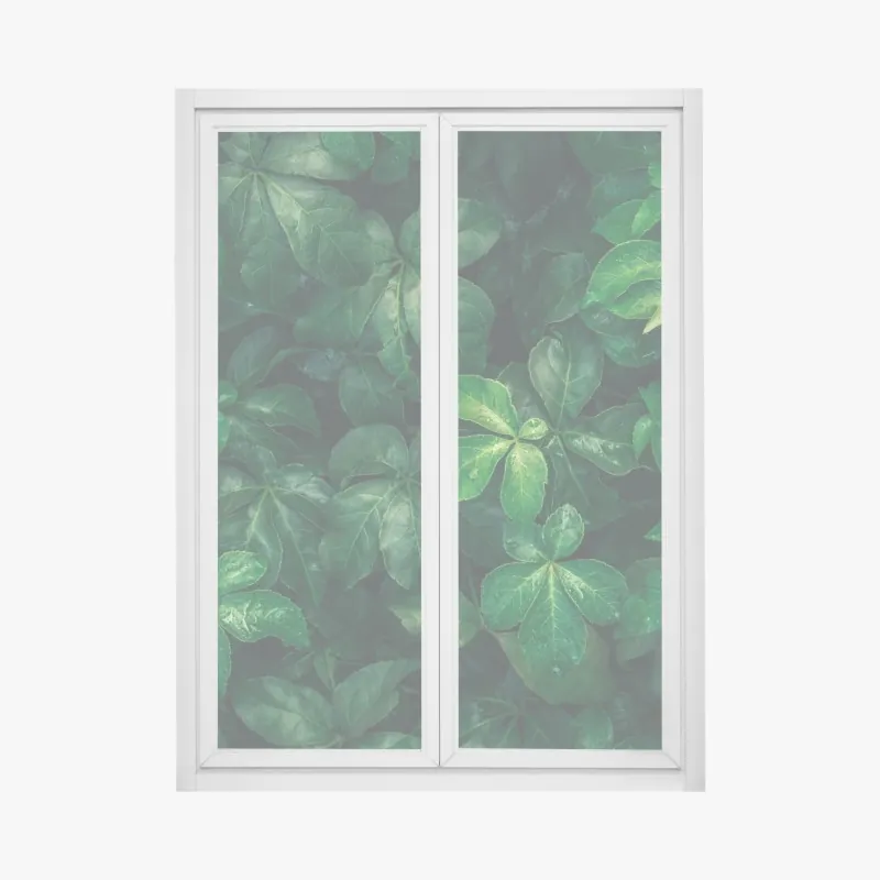 Naklejka na okno bujne tropikalne zielone liście