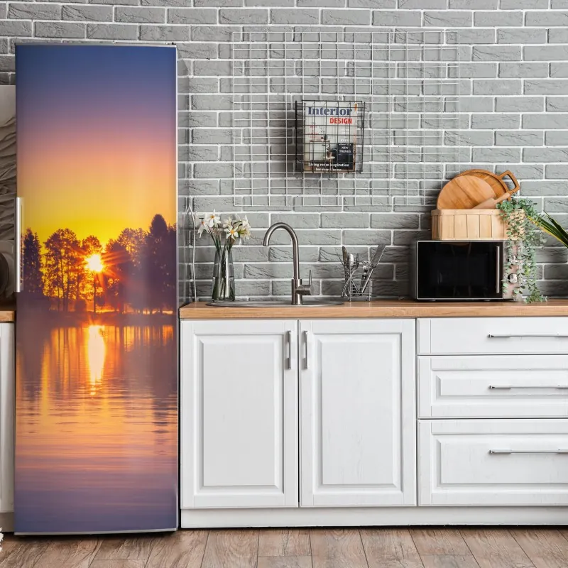 Naklejka na lodówkę mglisty zachód słońca nad jeziorem