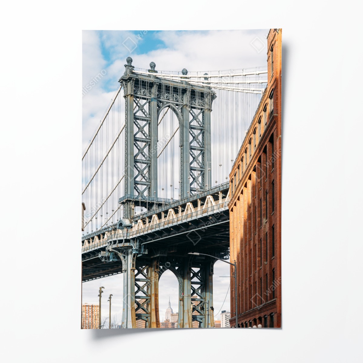 Poster Brooklyn bridge framed by brick buildings at sunset