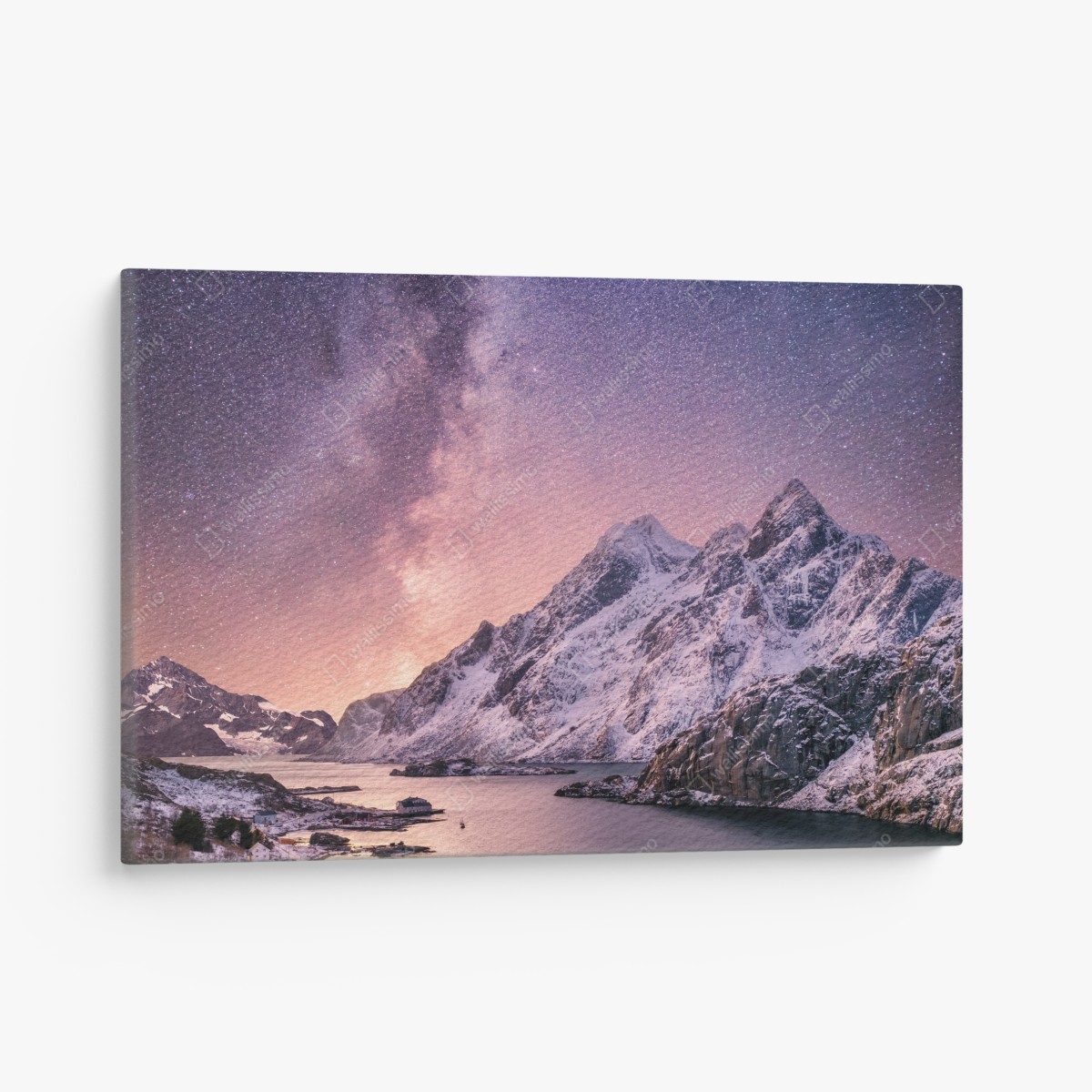 Canvas print milky way over snowy mountains in Norway