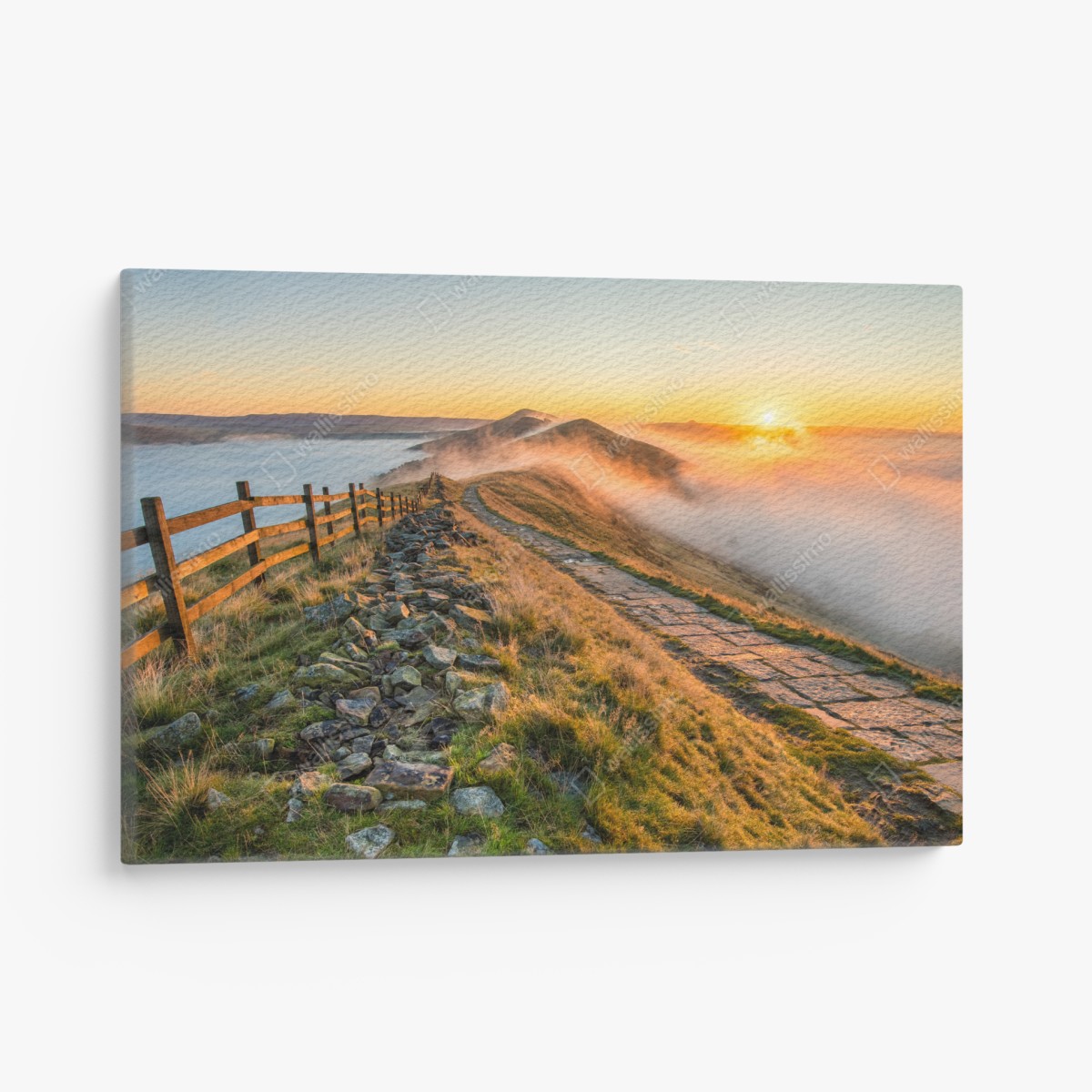 Canvas print sunrise over a misty ridge with a stone path