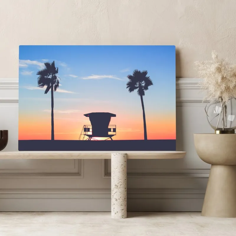 Obraz na płótnie zachód słońca nad plażą z sylwetką wieży ratownika – Wallissimo® Obraz na płótnie zachód słońca nad plażą z sylwetką wieży ratownika – Wallissimo®