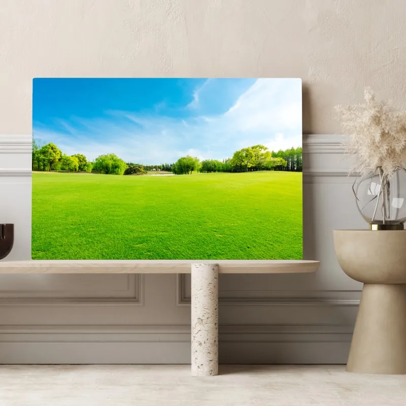 Obraz na płótnie spokojna zielona łąka pod błękitnym niebem – Wallissimo® Obraz na płótnie spokojna zielona łąka pod błękitnym niebem – Wallissimo®