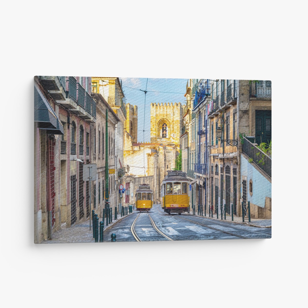 Canvas print sunlit trams on Lisbon's historic street