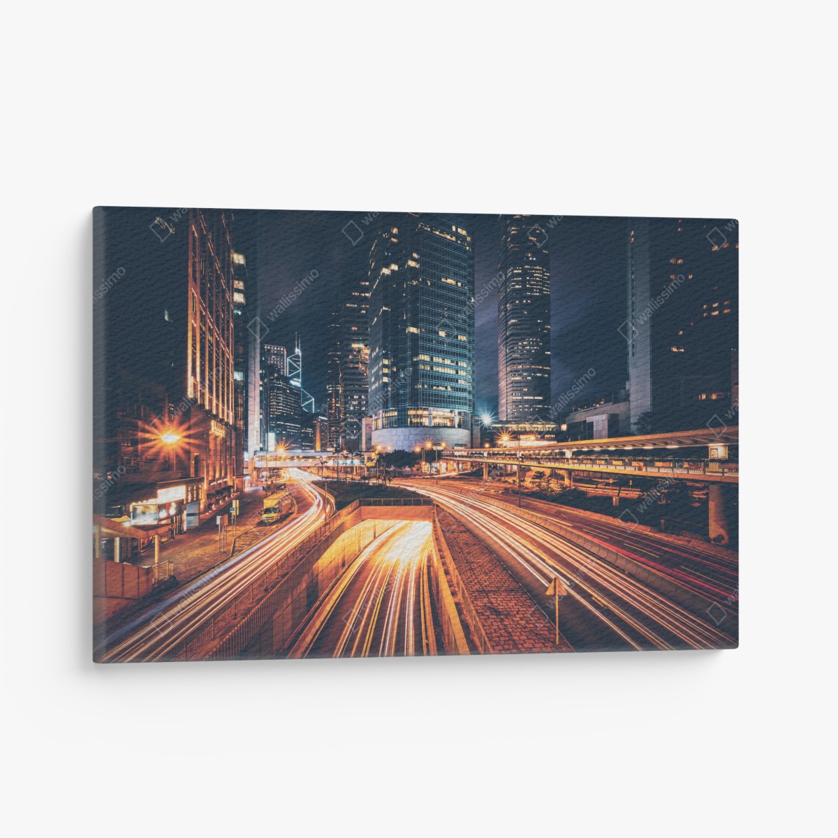 Canvas print night city light trails over urban highway